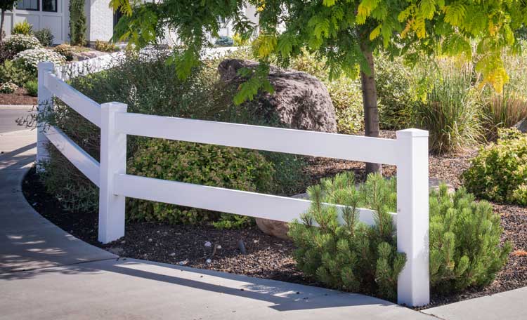 Landscaped white picket fence